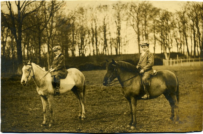 Jack and Oswald Holmes on horseback. 