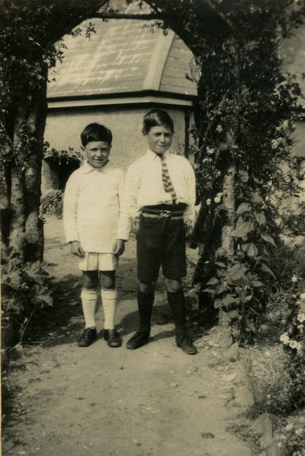 Ian and Colin Manning by an arbour in the garden