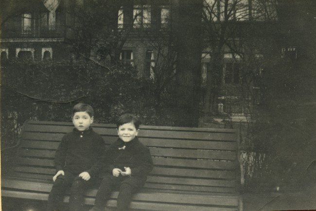 Ian and Colin Manning seated on bench.