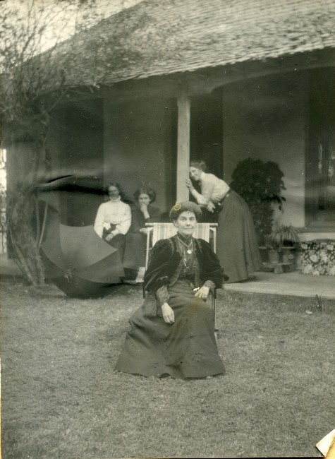 Florence Manning sitting in a chair in the garden 