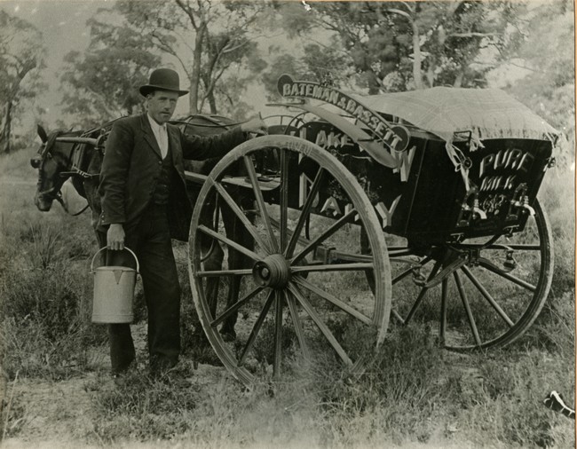 Joseph Bassett with milk cart.